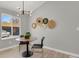 Small dining area with a round table and modern light fixture at 4750 E Louisiana Ave, Denver, CO 80246