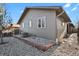 Gray house exterior with landscaping and a stone border at 4750 E Louisiana Ave, Denver, CO 80246