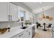 Modern kitchen with white cabinets, stainless steel appliances and breakfast nook at 4750 E Louisiana Ave, Denver, CO 80246