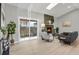 Bright living room with sliding glass doors leading to the backyard and a stone fireplace at 4750 E Louisiana Ave, Denver, CO 80246