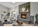 Living area featuring a stone fireplace and hardwood floors at 4750 E Louisiana Ave, Denver, CO 80246