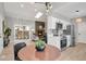 Open-concept living space combines kitchen, dining, and living areas with sleek finishes at 4750 E Louisiana Ave, Denver, CO 80246