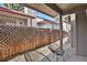 Private patio with wooden fence and gravel landscaping at 4750 E Louisiana Ave, Denver, CO 80246