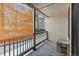 Private balcony with bamboo shade and exterior access at 14780 E Kentucky Dr # 414, Aurora, CO 80012