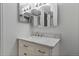 Bathroom with marble vanity top and mirrored medicine cabinet at 14780 E Kentucky Dr # 414, Aurora, CO 80012