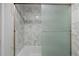 Updated bathroom with marble tile and a walk-in shower at 14780 E Kentucky Dr # 414, Aurora, CO 80012