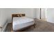 Cozy bedroom with mid-century modern furniture and carpet flooring at 14780 E Kentucky Dr # 414, Aurora, CO 80012