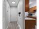Bright condo entryway with wood-look floors and kitchen access at 14780 E Kentucky Dr # 414, Aurora, CO 80012