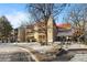 Attractive exterior of a condo building with snow-covered landscaping at 14780 E Kentucky Dr # 414, Aurora, CO 80012