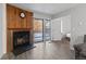 Cozy brick fireplace with wood paneling in the living room at 14780 E Kentucky Dr # 414, Aurora, CO 80012
