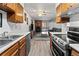 Open kitchen with a view into the living room and fireplace at 14780 E Kentucky Dr # 414, Aurora, CO 80012