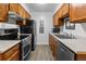 Efficient galley-style kitchen, featuring modern appliances and ample cabinetry at 14780 E Kentucky Dr # 414, Aurora, CO 80012
