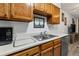 Clean and bright kitchen with a double sink and modern dishwasher at 14780 E Kentucky Dr # 414, Aurora, CO 80012