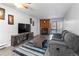 Living room features a fireplace, flat-screen TV and comfy couch at 14780 E Kentucky Dr # 414, Aurora, CO 80012