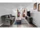 Open living room layout with kitchen views and grey couch at 14780 E Kentucky Dr # 414, Aurora, CO 80012