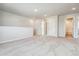 Large bonus room boasts plush carpet, recessed lighting and great natural light at 4334 Gozzer Ranch Dr, Elizabeth, CO 80107