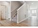 Hallway featuring stairs, neutral paint, and access to living spaces and bedrooms at 4334 Gozzer Ranch Dr, Elizabeth, CO 80107