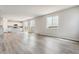 Open floor plan showing living room, kitchen, natural light, and hardwood floors at 4334 Gozzer Ranch Dr, Elizabeth, CO 80107