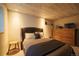 Cozy bedroom features wood ceiling, neutral tones, and comfortable furnishings at 2231 Meadow Green Cir, Franktown, CO 80116