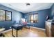 Stylish home office with custom cabinets and an abundance of natural light creates the perfect workspace at 2231 Meadow Green Cir, Franktown, CO 80116