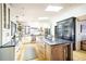 Bright kitchen with center island, skylights, and lots of counter space makes cooking a breeze at 2231 Meadow Green Cir, Franktown, CO 80116