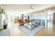 Spacious living room features a fireplace, hardwood floors, and an open layout connecting to the kitchen at 2231 Meadow Green Cir, Franktown, CO 80116