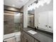 Modern bathroom with a glass shower, sleek vanity with gray countertop, and stylish finishes at 730 Edenborn Pl, Castle Rock, CO 80104