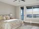 Comfortable bedroom with bright light, balcony access, neutral colors, and wood-look flooring at 730 Edenborn Pl, Castle Rock, CO 80104