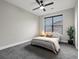 Comfortable bedroom with large window and ceiling fan at 730 Edenborn Pl, Castle Rock, CO 80104