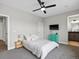 This bedroom has neutral walls, carpet, a ceiling fan, and a colorful dresser and lamp at 730 Edenborn Pl, Castle Rock, CO 80104