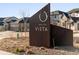Entrance sign for Montaine Vista featuring native landscaping and modern design at 730 Edenborn Pl, Castle Rock, CO 80104
