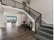 Modern staircase with iron railing and hardwood floors, creating an inviting and contemporary ambiance at 730 Edenborn Pl, Castle Rock, CO 80104