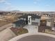 Stunning gray two-story home with a three-car garage and professionally landscaped front yard at 730 Edenborn Pl, Castle Rock, CO 80104
