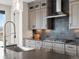 The kitchen features custom cabinets, stainless steel appliances, and views of the outside at 730 Edenborn Pl, Castle Rock, CO 80104