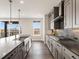 Well-designed kitchen featuring gray cabinetry, stainless steel appliances, and scenic outdoor views at 730 Edenborn Pl, Castle Rock, CO 80104