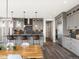 Beautiful eat-in kitchen featuring granite countertops, stainless steel appliances and a wooden breakfast table at 730 Edenborn Pl, Castle Rock, CO 80104