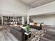 Open-concept living room featuring high ceilings, modern decor, and seamless flow to the dining and kitchen areas at 730 Edenborn Pl, Castle Rock, CO 80104