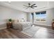 Comfortable main bedroom featuring hardwood floors, a ceiling fan, and access to a balcony at 730 Edenborn Pl, Castle Rock, CO 80104