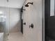 Modern shower with sleek fixtures, tiled walls, and mosaic tile flooring at 730 Edenborn Pl, Castle Rock, CO 80104