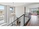 Open staircase with modern railing leading to a bright and airy upper level at 730 Edenborn Pl, Castle Rock, CO 80104