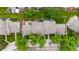 Aerial view of townhouses featuring well-maintained roofs, private patios, and landscaped yards, perfect for outdoor living at 9632 W Chatfield Ave # C, Littleton, CO 80128