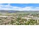 Beautiful aerial view of a neighborhood with mountain views and lush green landscaping at 9632 W Chatfield Ave # C, Littleton, CO 80128