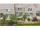 Aerial view of townhomes with back patios and artificial turf for easy maintenance at 9632 W Chatfield Ave # C, Littleton, CO 80128