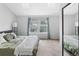 Bright bedroom with two skylights, a large bed, soft carpet, and ample closet space at 9632 W Chatfield Ave # C, Littleton, CO 80128
