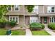 Well-maintained townhouse featuring neutral siding, neat landscaping, and a welcoming entrance at 9632 W Chatfield Ave # C, Littleton, CO 80128