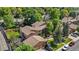 Charming condo complex featuring mature trees, manicured lawns, and convenient parking for residents and guests at 9587 W 89Th Cir, Broomfield, CO 80021