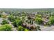 Picturesque aerial view of the condo complex featuring lush greenery and a neighborhood swimming pool at 9587 W 89Th Cir, Broomfield, CO 80021