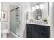 Updated bathroom with sleek vanity, shower with glass door and modern fixtures at 9587 W 89Th Cir, Broomfield, CO 80021