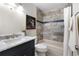 Updated bathroom with modern vanity, tile accents, and a shower-tub combination at 9587 W 89Th Cir, Broomfield, CO 80021