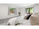 Comfortable bedroom with plush carpeting, neutral decor, and lots of natural light at 9587 W 89Th Cir, Broomfield, CO 80021